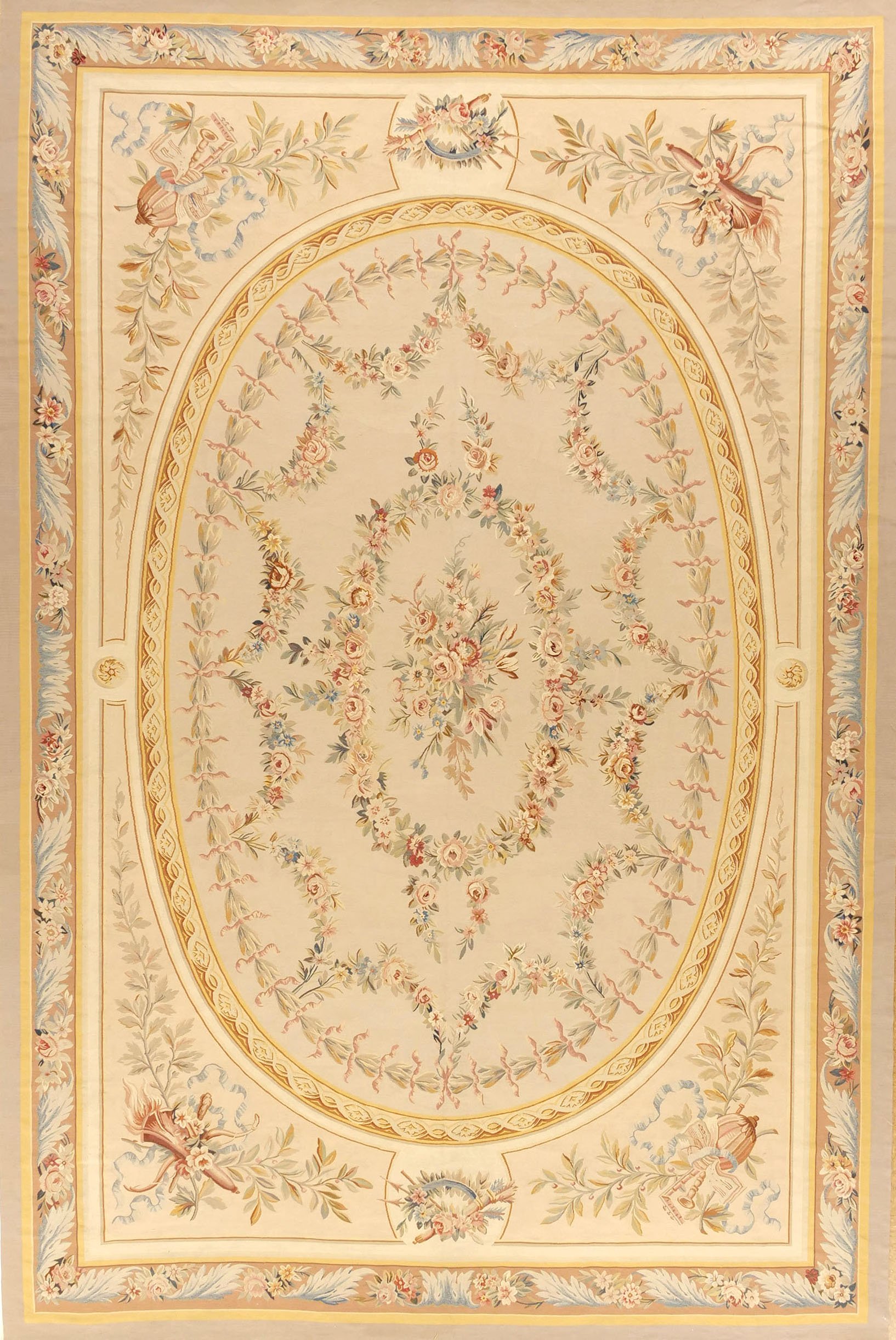 Aubusson  area rug with a central bouquet of flowers, surrounded by a decorative border featuring flowers and birds.
