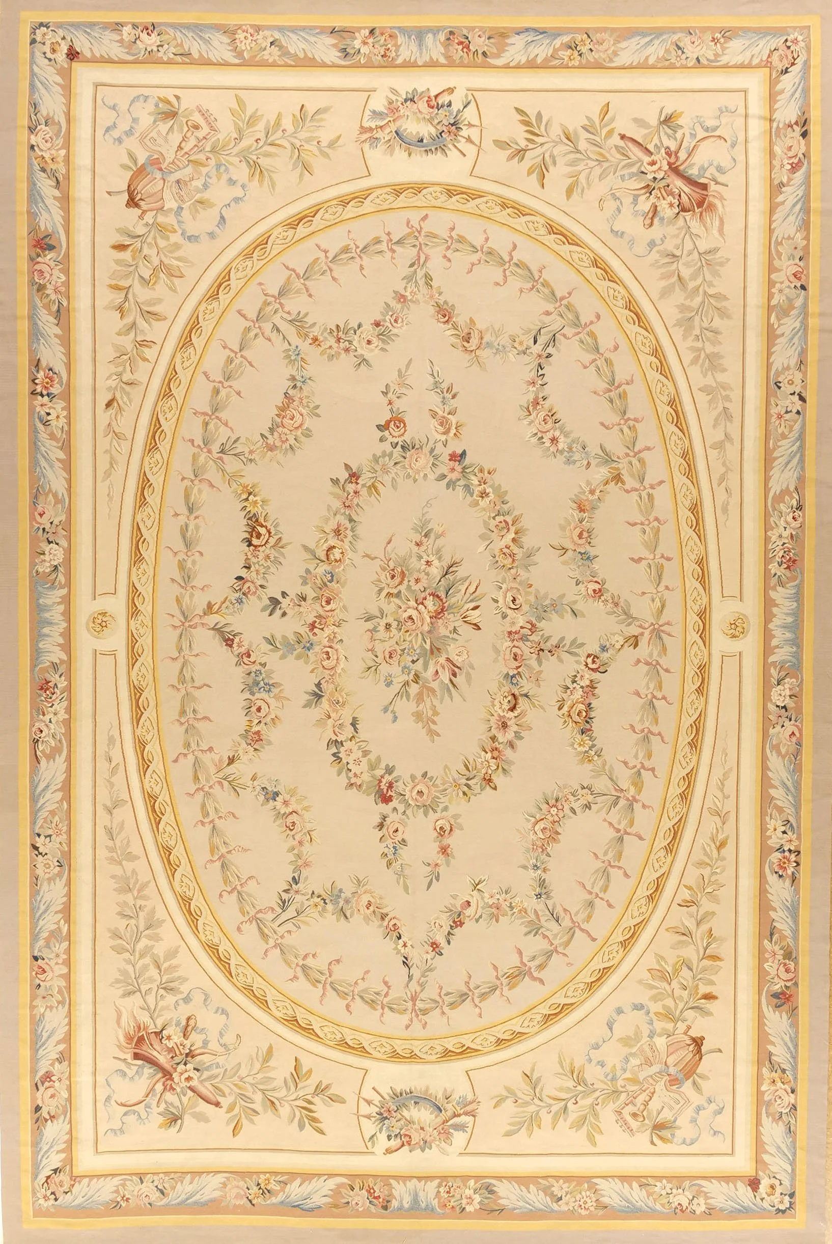 Aubusson  area rug with a central bouquet of flowers, surrounded by a decorative border featuring flowers and birds.
