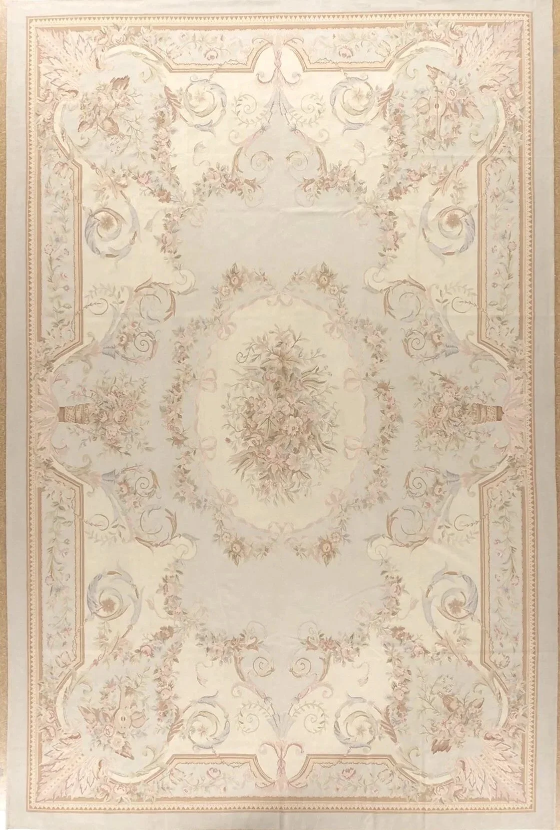 handwoven of wool this pastel aubusson rug features soft colors and ornate design including musical instruments