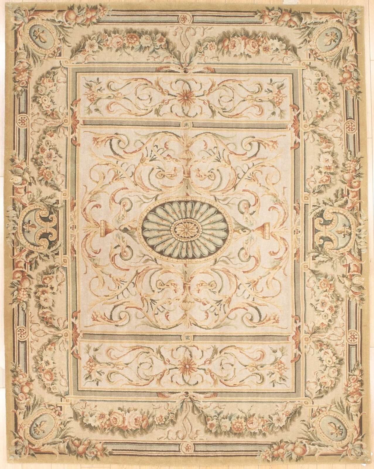 A decorative ornate ceiling or rug design with floral patterns, scrollwork, and symmetrical motifs in pastel pink, green, beige, and gold tones.