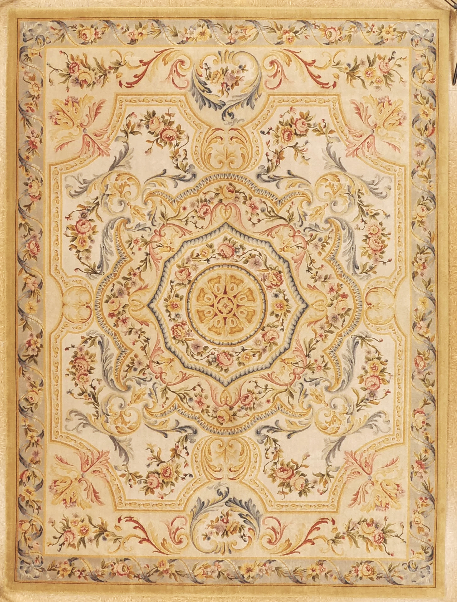 Savonnerie rug in gold, blue and ivory colors