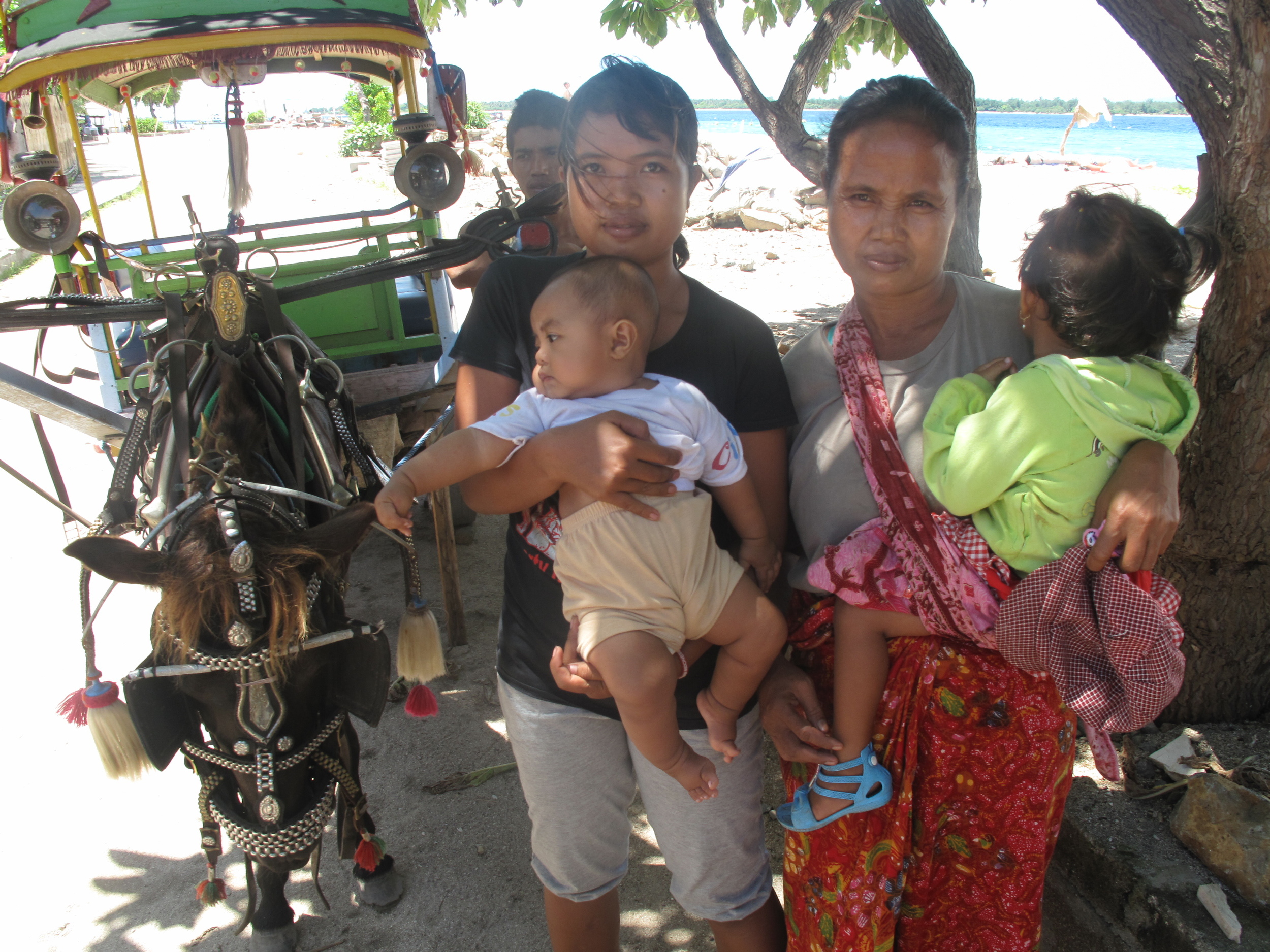 Right on grandma's hip is Sintia Lestari. Left on Mum's hip is her nephew - another clubfoot baby.