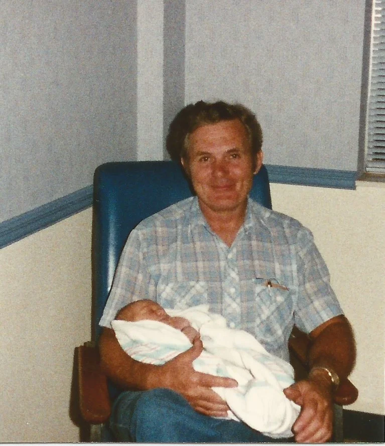 One day old and Papaw is already wrapped around her little finger!