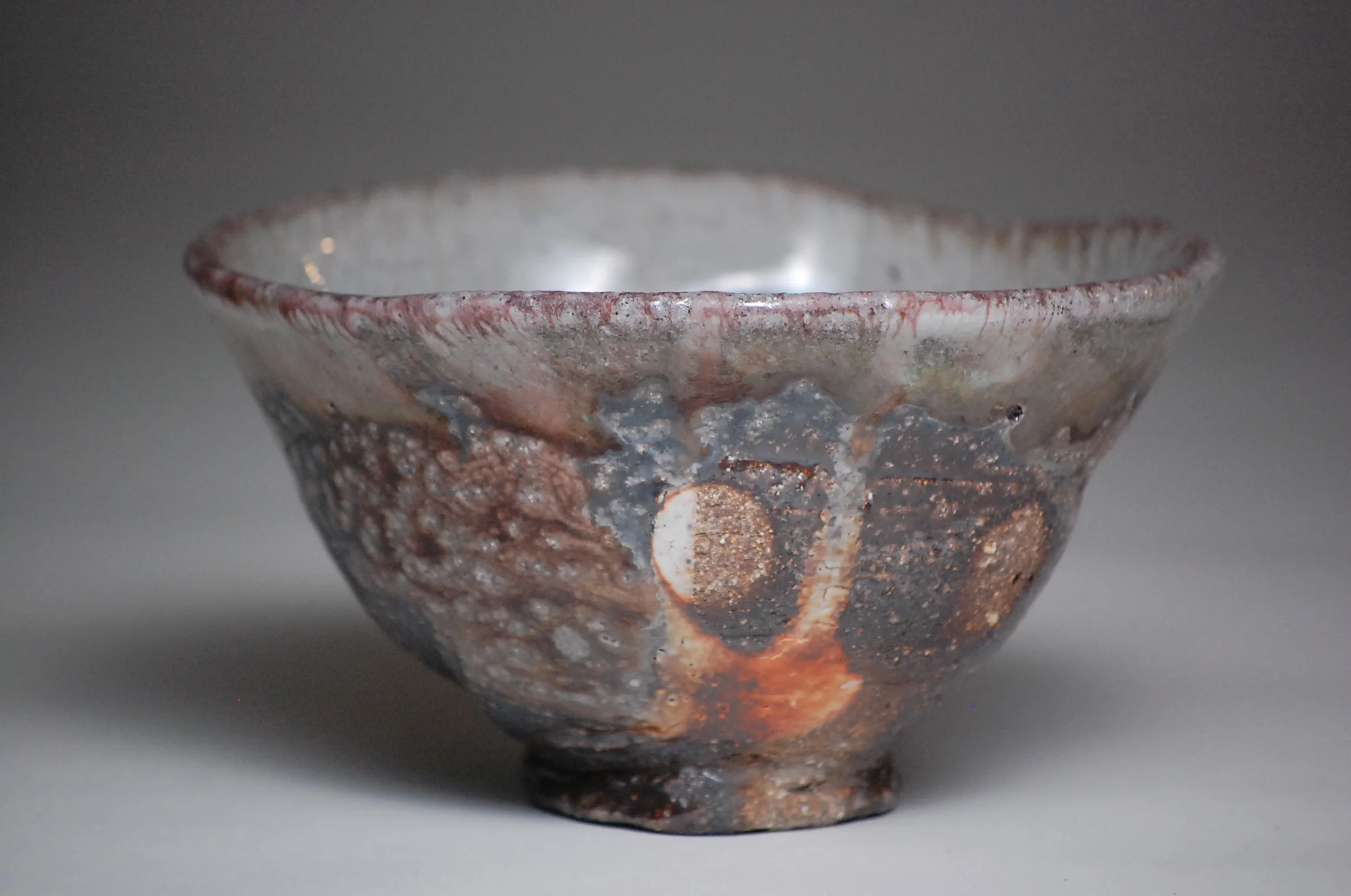 Soda fired thrown and hand carved foot.