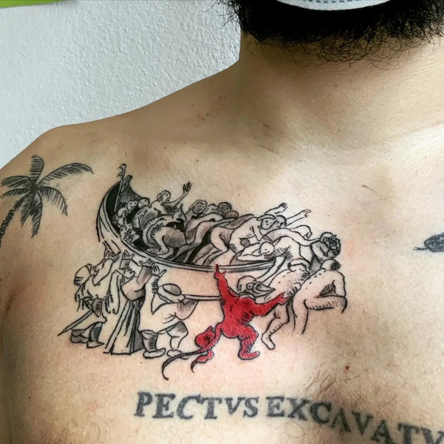 Detailed tattoo on the upper chest inspired by art history, showing fine line drawing, black contrast, and a red figure within the tattoo work of jorgedacruz.