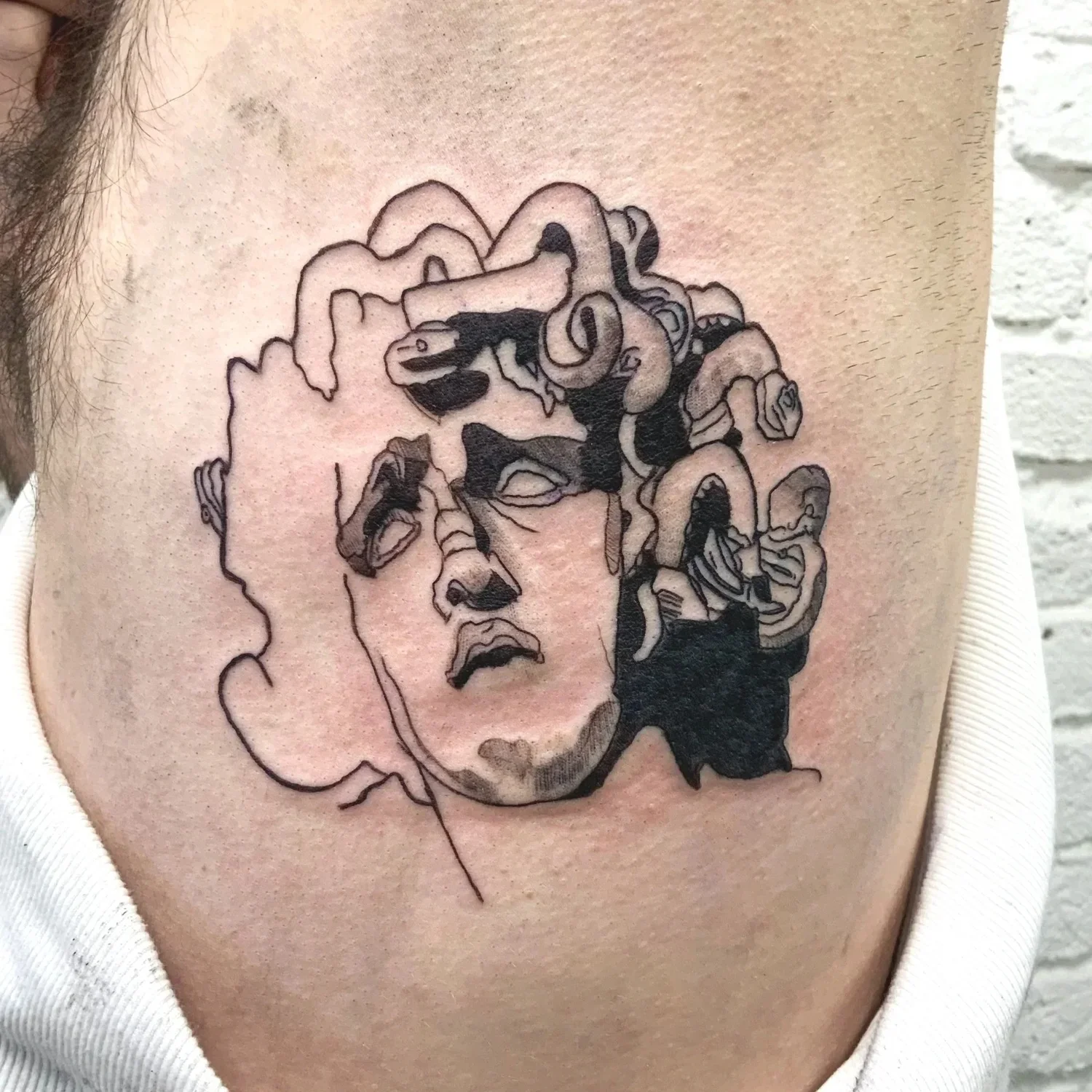 Bernini’s Medusa tattoo by noTATTOO Berlin, inspired by vulnerability, transformation, classical sculpture, and the emotional weight of the Medusa myth.