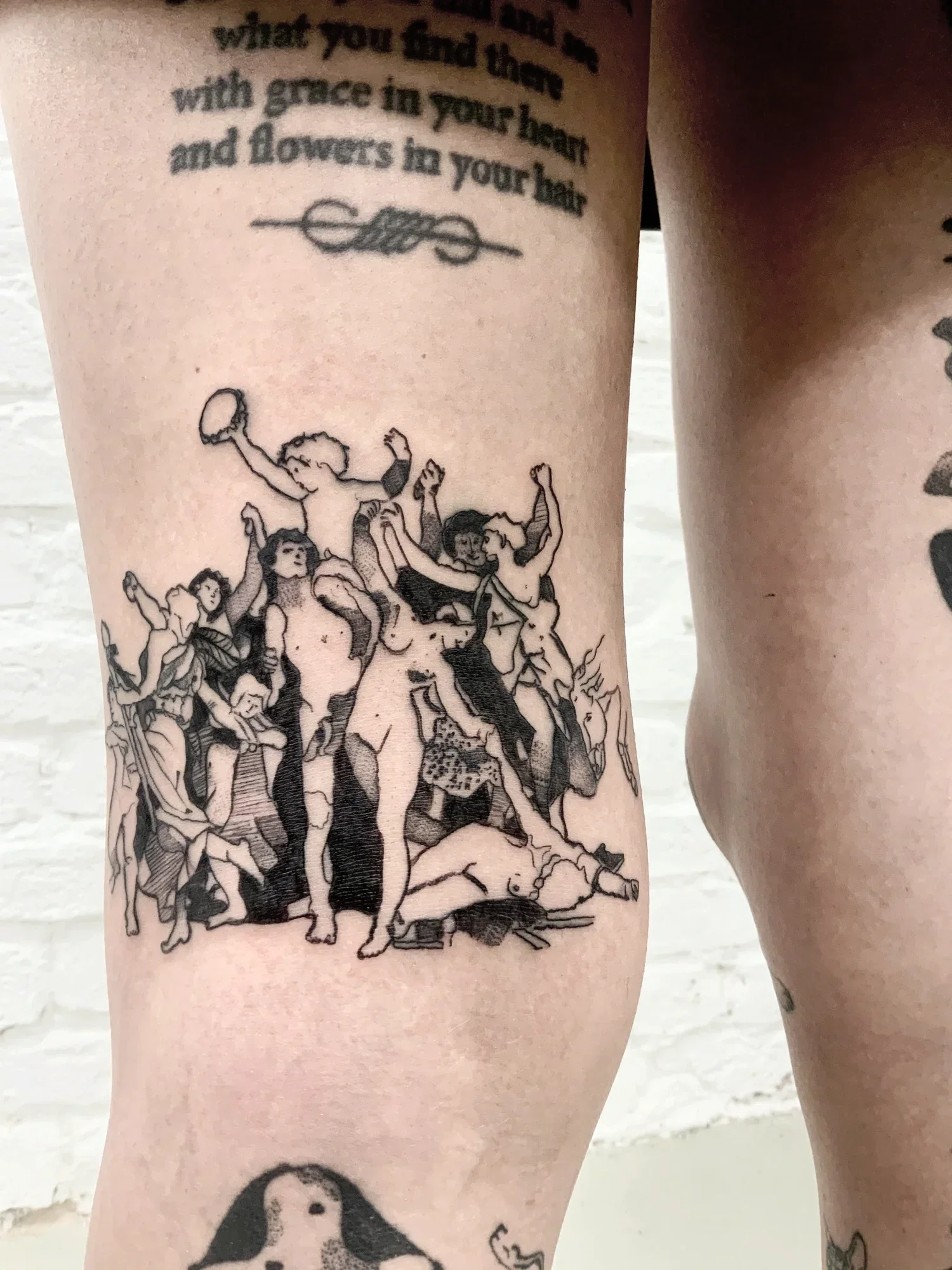 Detail of Bacchus-inspired tattoo placed behind the knee, showing fine line work, classical reference, and movement within the tattoo work of jorgedacruz.