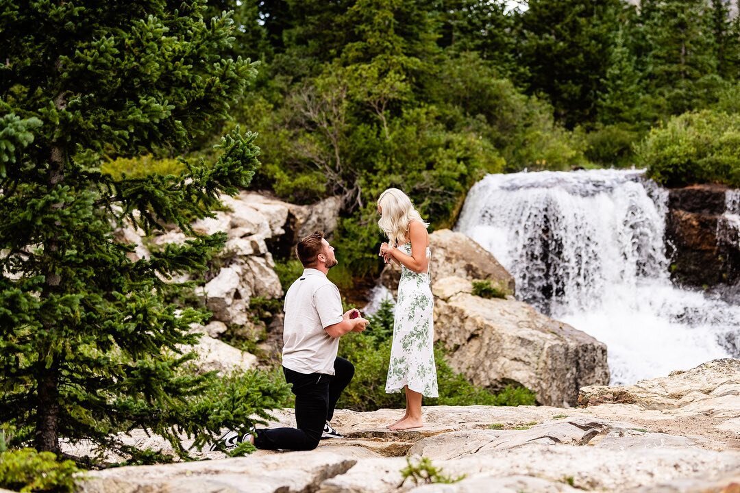 Tanner + Kennedy came from Kansas City for a vacation in Colorado! Before going out to dinner in Breckenridge, they went sightseeing in the mountains. As they approached a lil hidden waterfall, Tanner got down on one knee and proposed! Kennedy was al