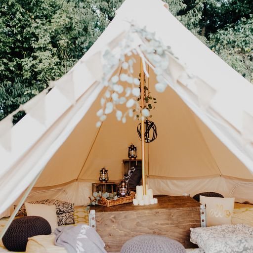Luxury glamping tent setup with lanterns and decor for Los Angeles event production