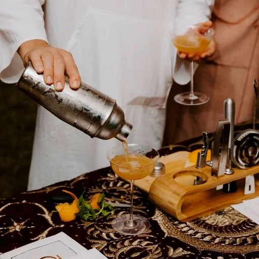 Bartender crafting cocktails at a glamping bar setup for events in Los Angeles — mobile bar services offered nationwide