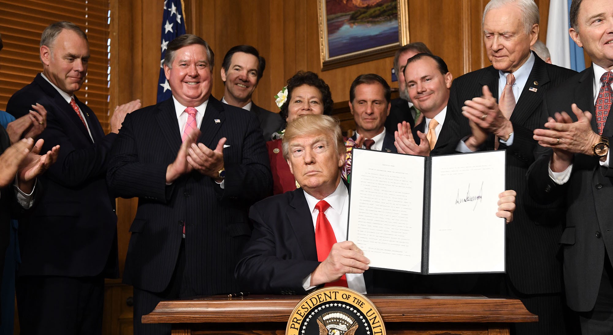President Trump signs an executive order at the Department of the Interior in April, shrinking Bears Ears National Monument in Utah