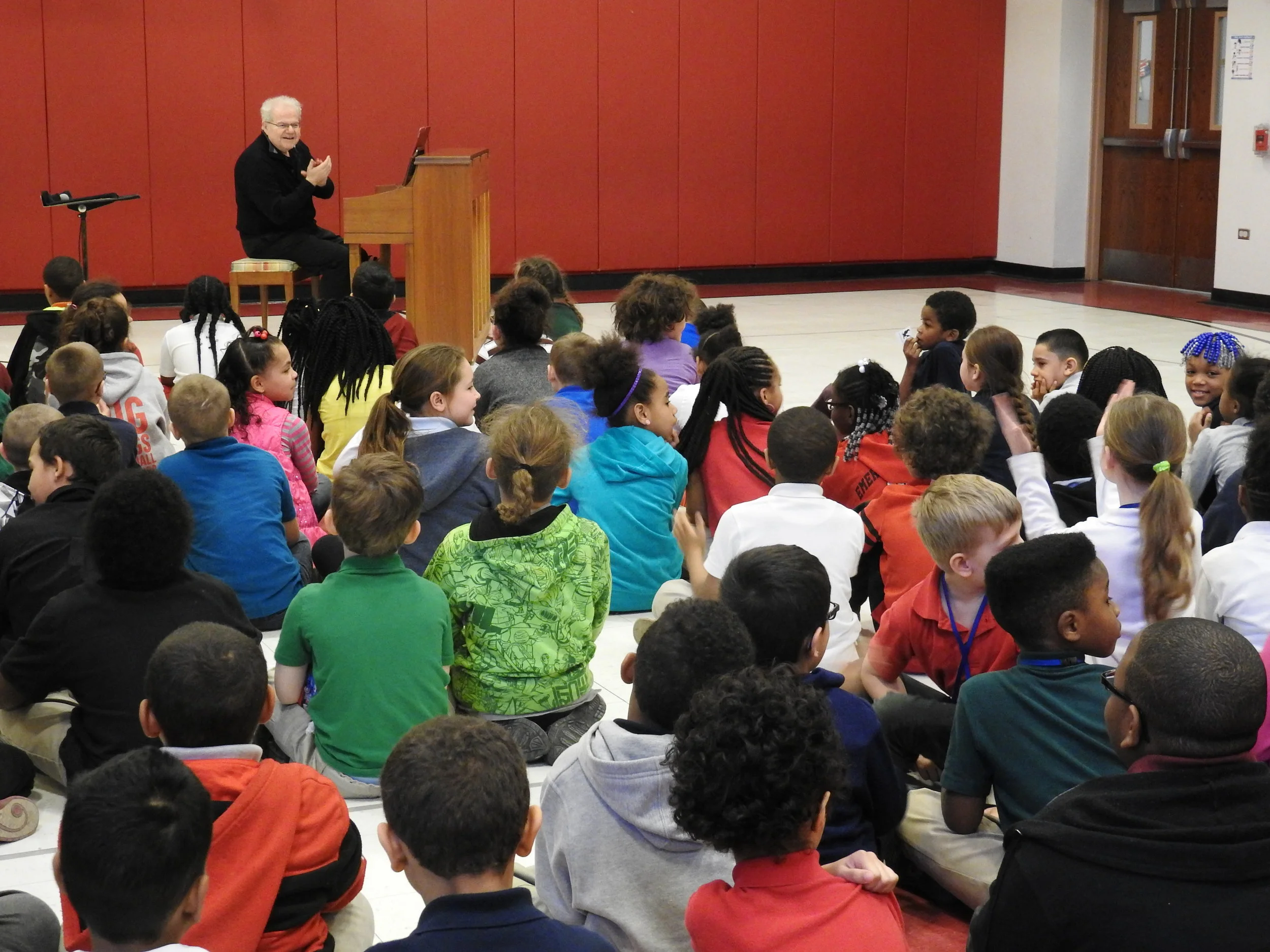 Pianist Emanuel Ax performing at the Emerson Gridley Elementary School in Erie, Pennsylvania, as a guest artist brought in by Erie Philharmonic.