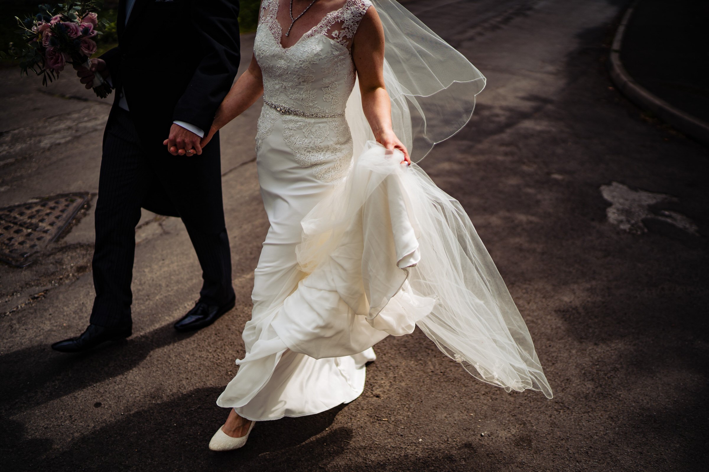 bride and groom - walking - windy - dress.jpg