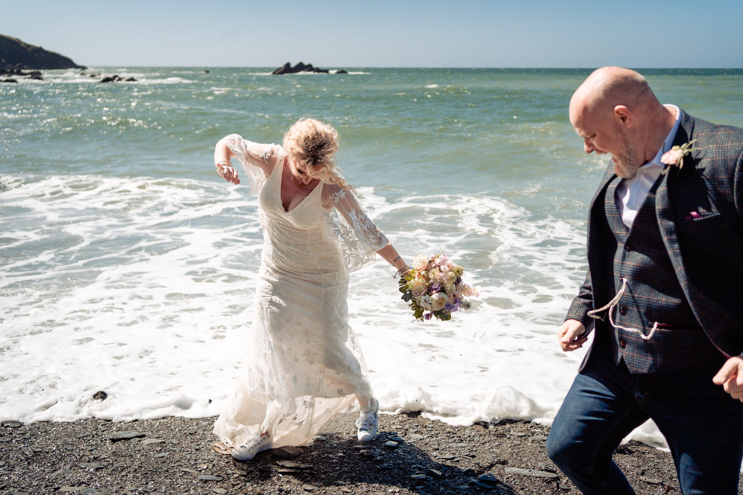 bride and groom - waves - tunnels beach - wedding.jpg