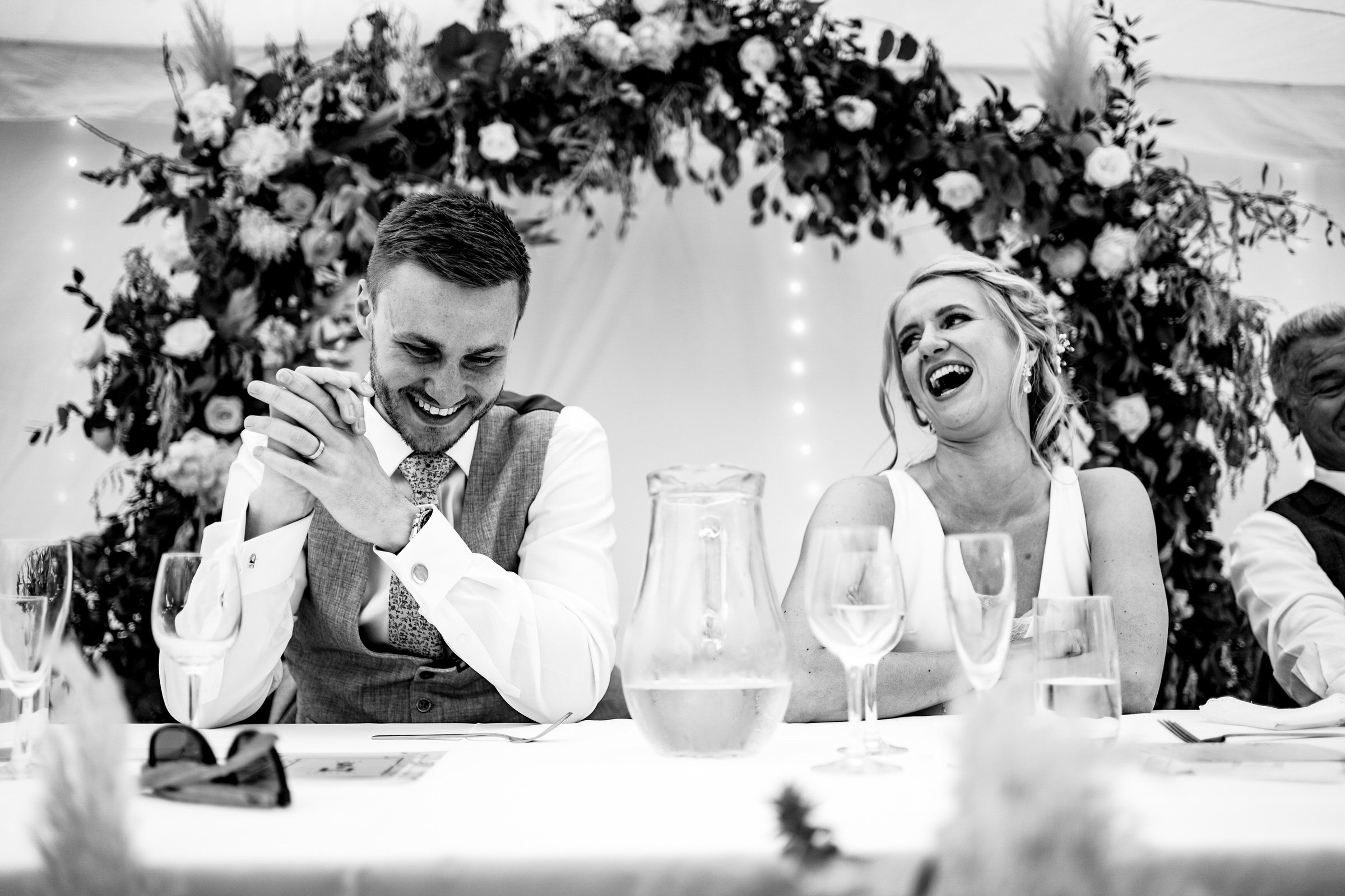 bride and groom - laughing - black and white.jpg