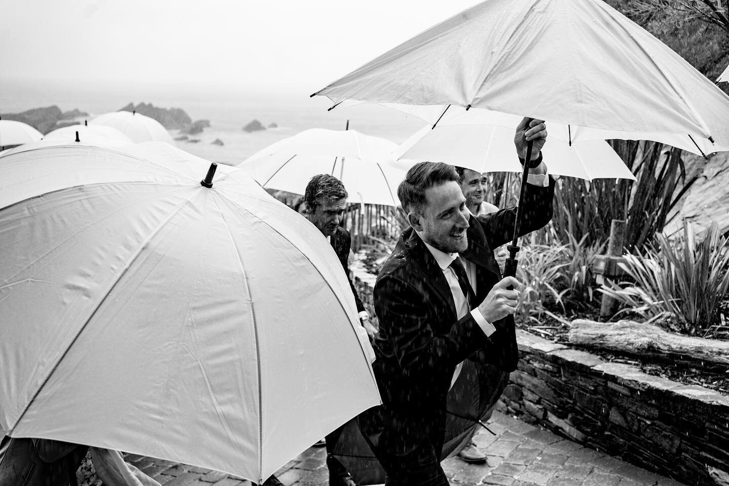 (Literal) mid ceremony rain, but spirits were still high and we all made a dash for cover! 🌦️🌂 These are those moments to capture!