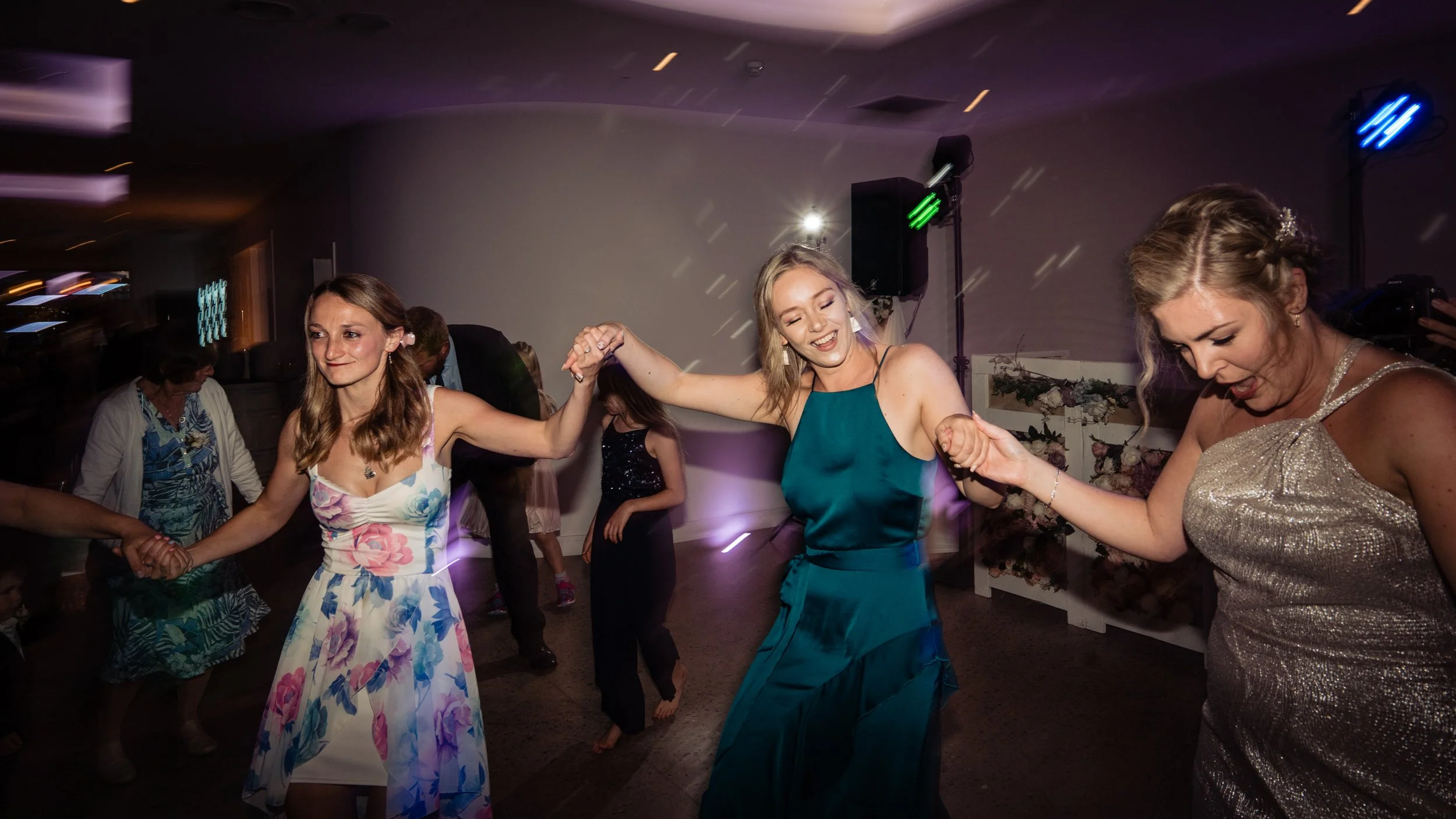 wedding guests dancing at sandy cove hotel