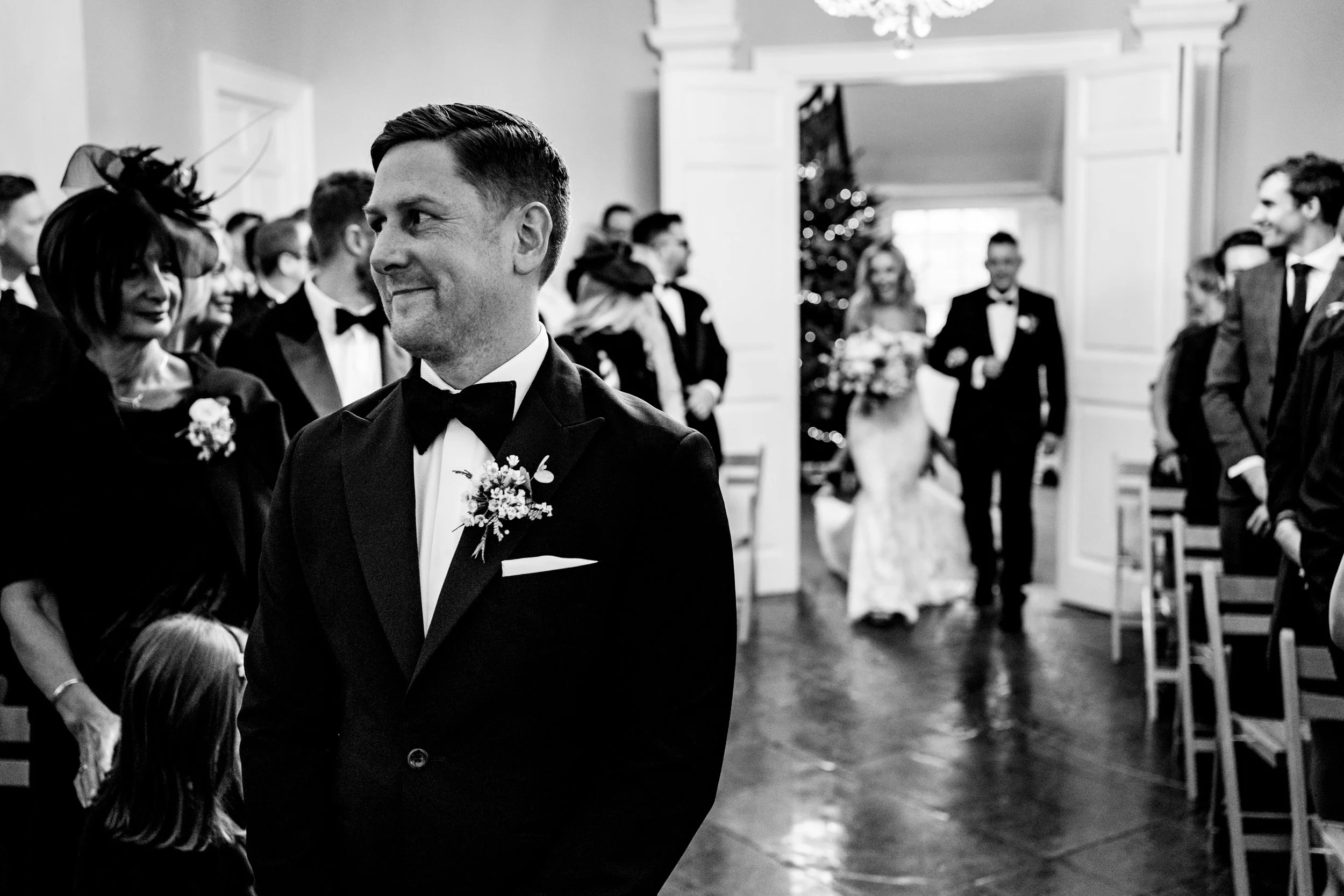 black and white wedding photo at kingston estate groom waiting for bride