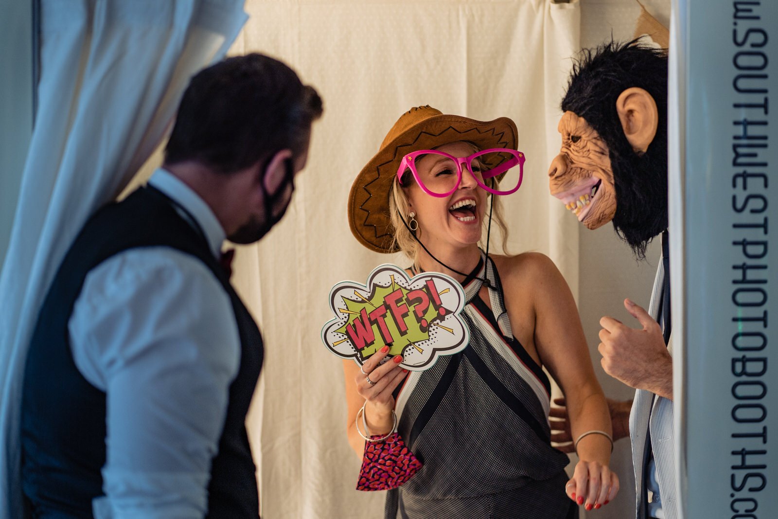wedding guests in a photo booth sandy cove