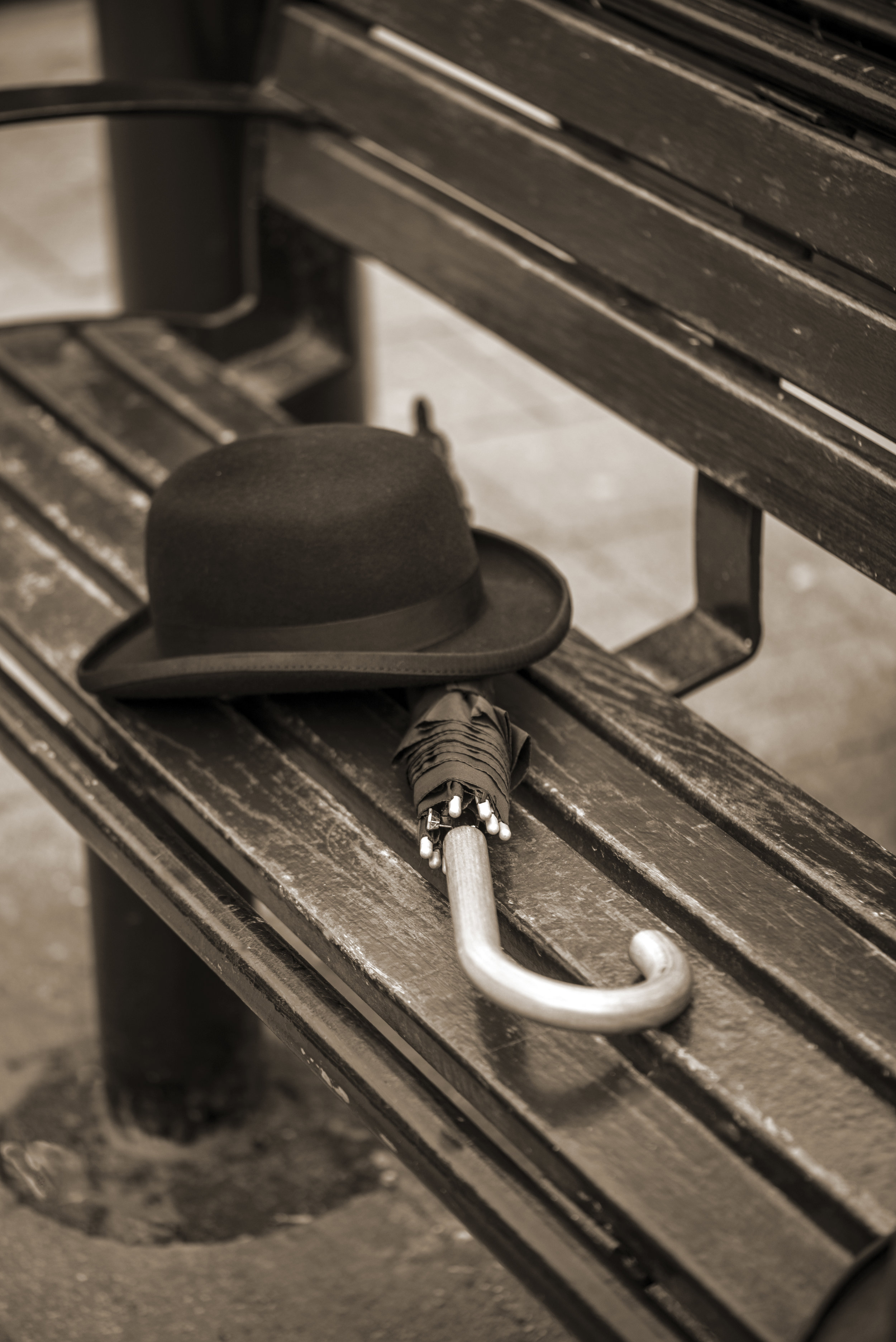 Bowler and brolly on bench Hereford.jpg