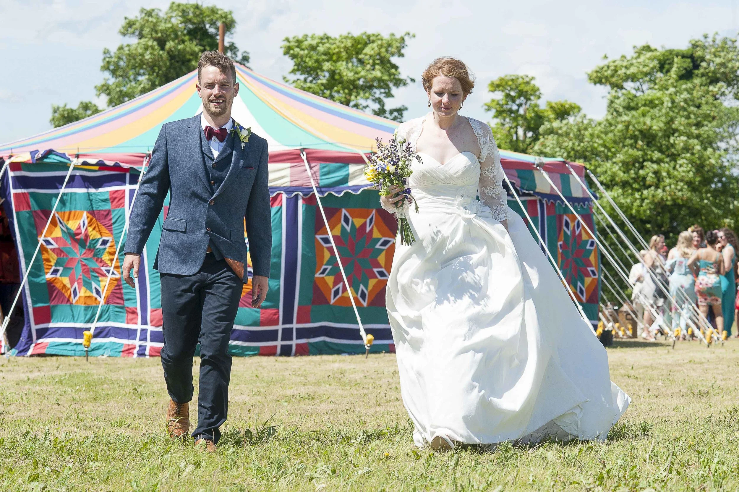 Bridal couple with circus tent in the background