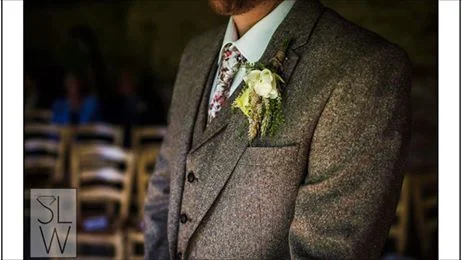 Close up of tweed wedding suit