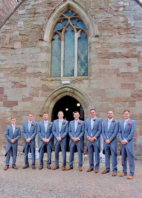 Group of of men in grey wedding suits