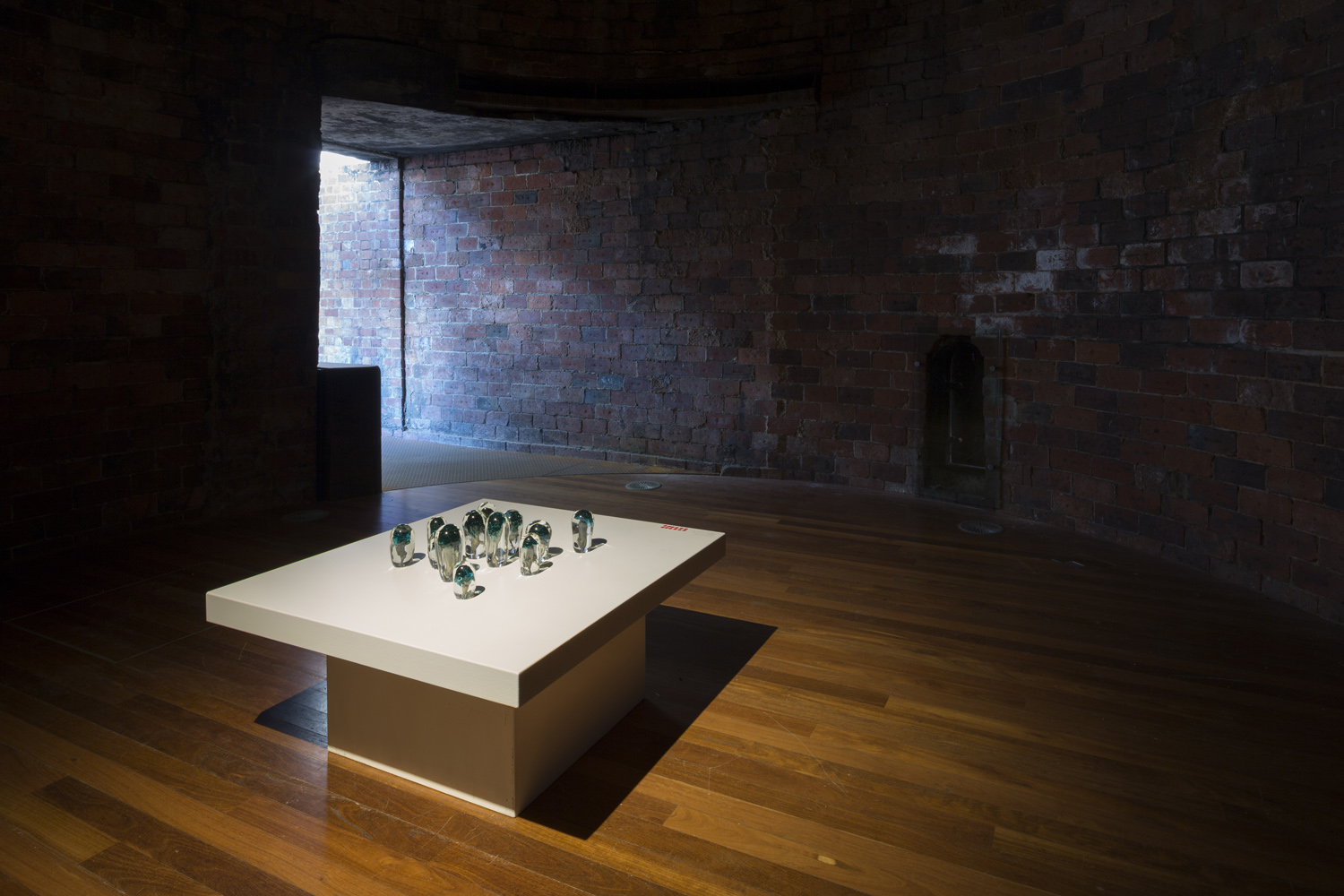 Collaboration with Emilie Patteson, Mushrooms, hot-sculpted glass with mushroom and copper inclusions, 2014, (photo by Adam McGrath), Canberra Glassworks GLINT exhibition install