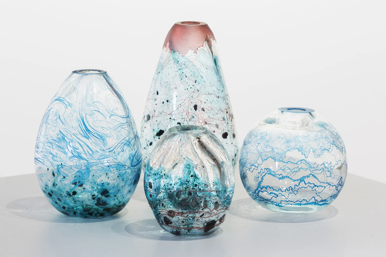Annika Romeyn, Fluid, Sediment and Contour Vessels, blown and engraved glass with copper inclusions and oil paint, 2014 (photo by Adam McGrath), Canberra Glassworks GLINT exhibition install