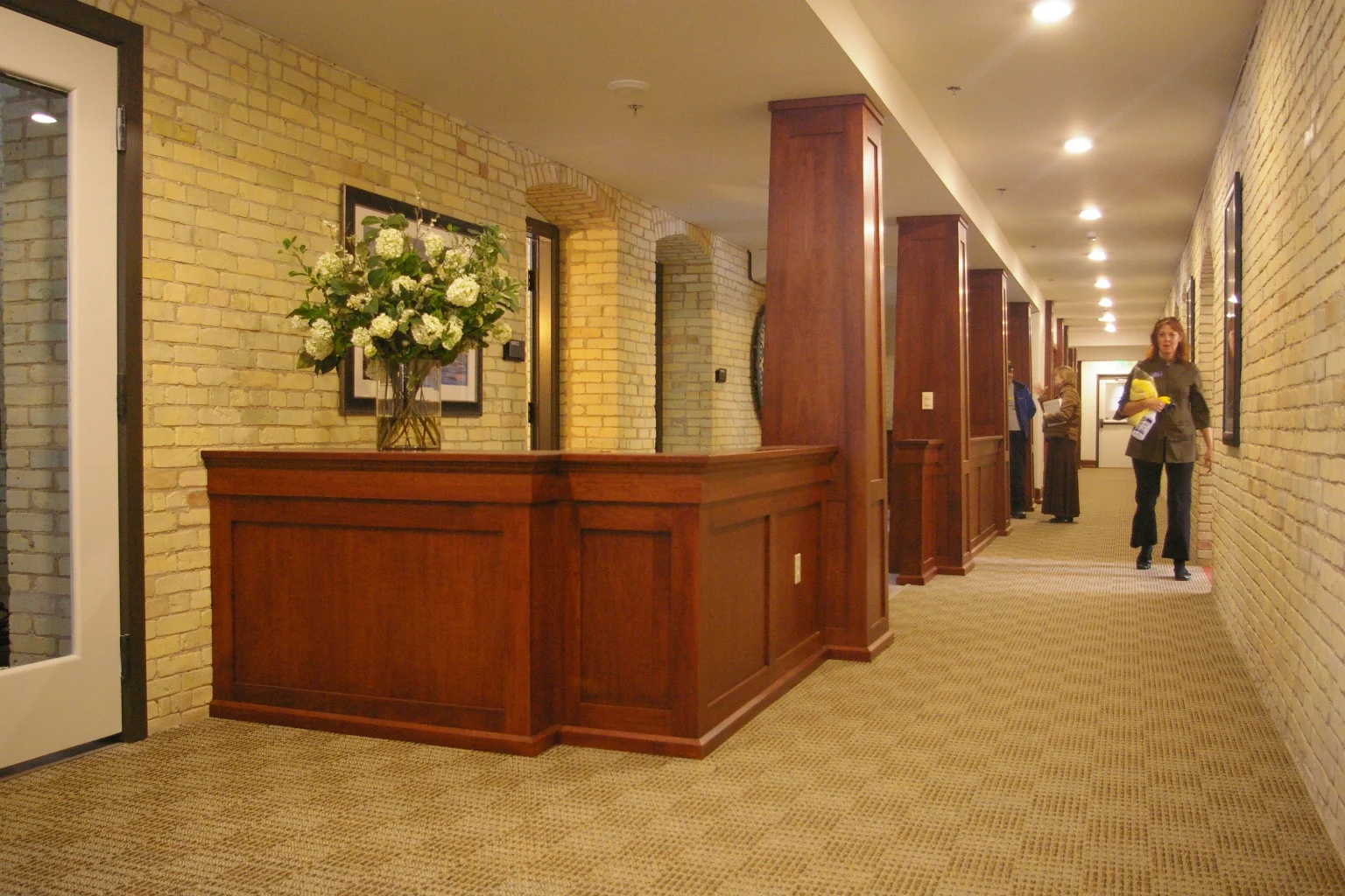 Mahogany reception desks and columns.