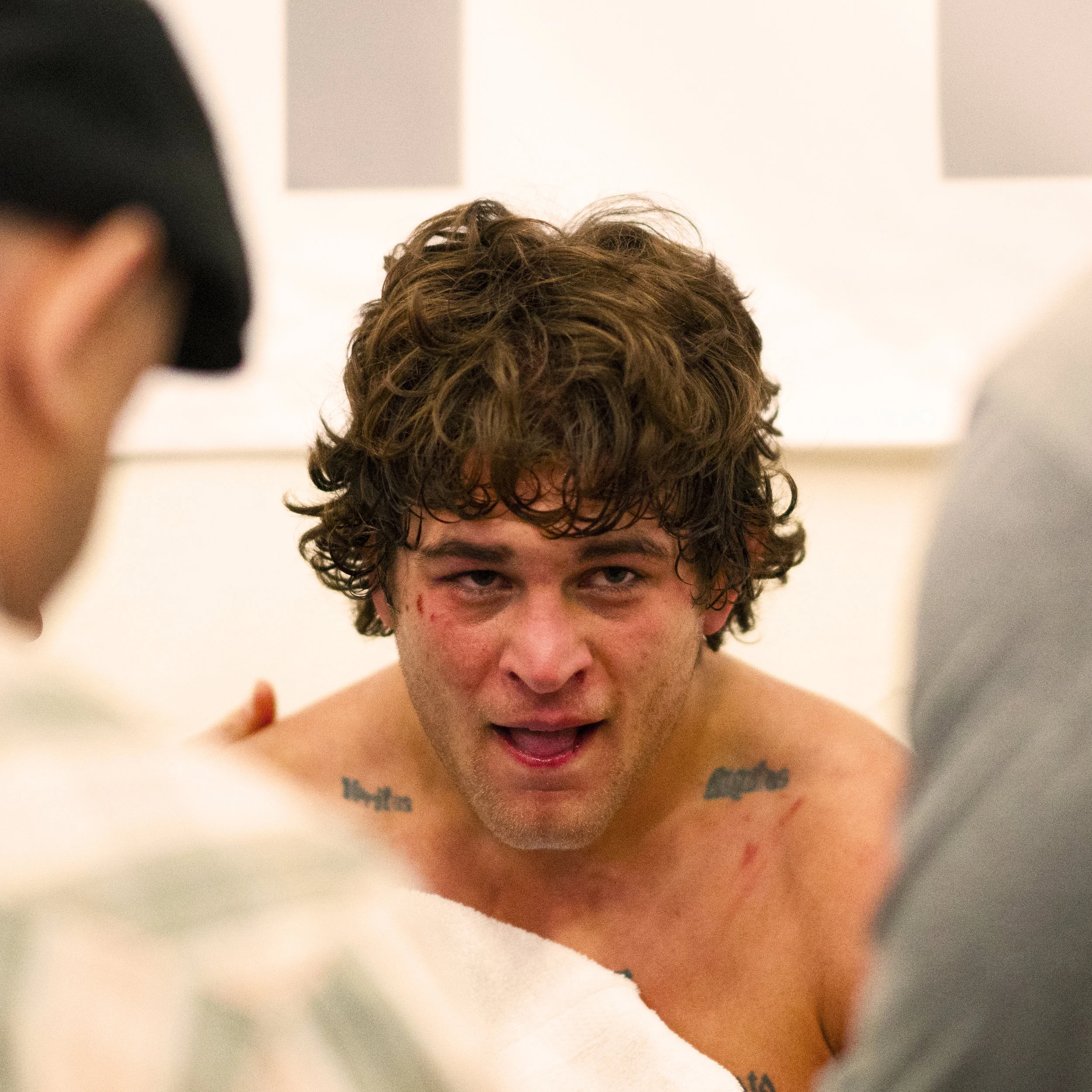 Patrick Downey decompresses with his coaches after upsetting Cornell's Gabe Dean in the wrestle back round of the 2017 U.S. Open.
