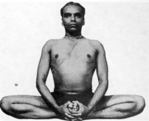 The great Mr. Iyengar in Baddha Konasana. Plate 101 in B.K.S. Iyengar (1966), Light on Yoga.