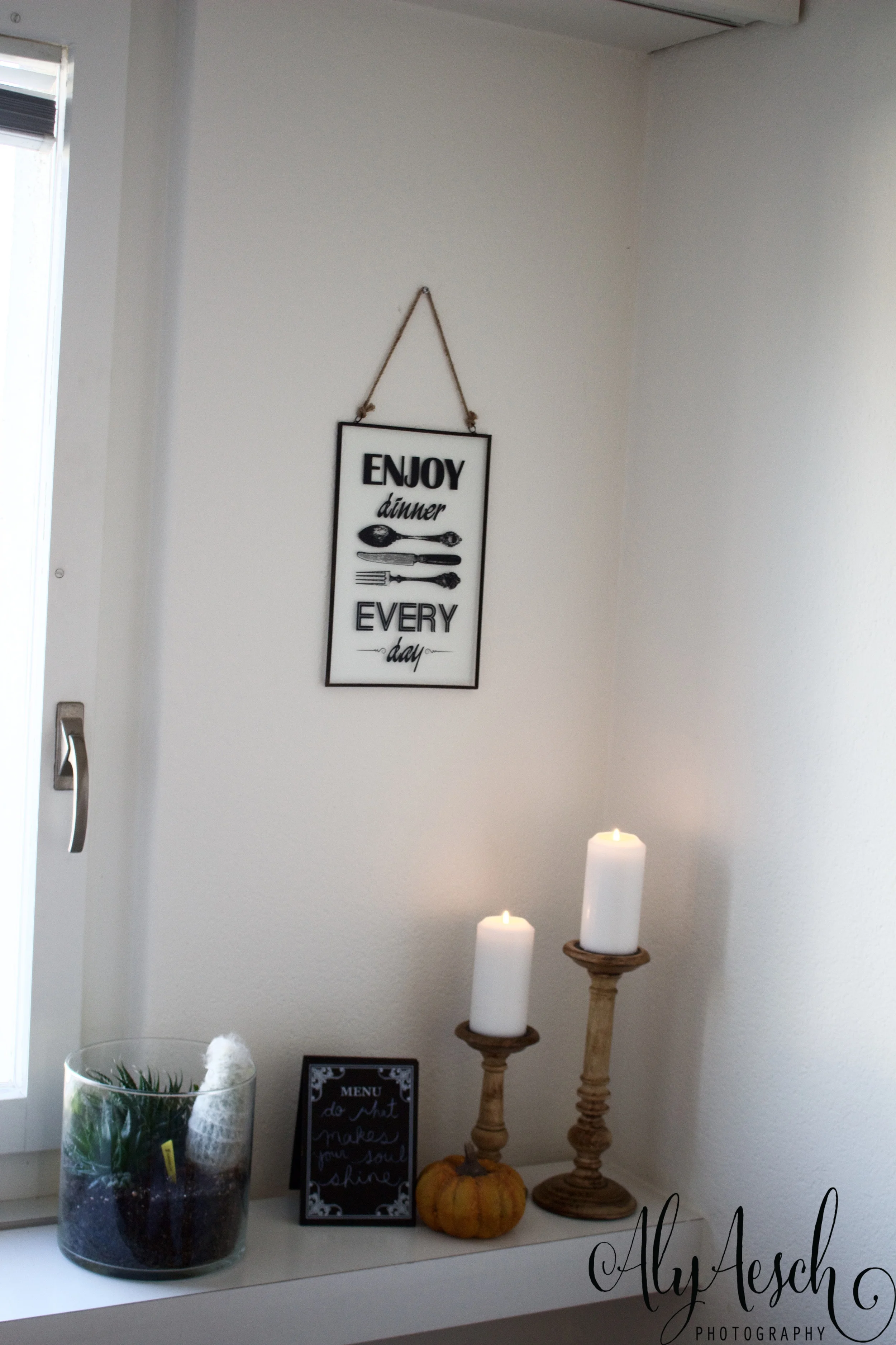 This is my favorite corner of the dining room. These candle sticks and this glass frame are almost TOO perfect. Every time I look over, it makes me all warm and fuzzy ;) Candle Sticks - Depot Glass Frame - Depot Pumpkin - Migros Chalkboard Menu sign - Migros