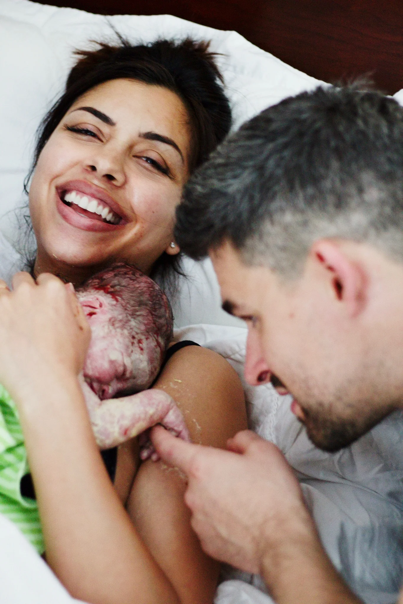 Copyright Nicole Burron This post contains photos that feature blood and bodily fluids as well as placenta. No vaginal shots are shown. These photos are incredibly intimate to us and not to be used without our permission. 