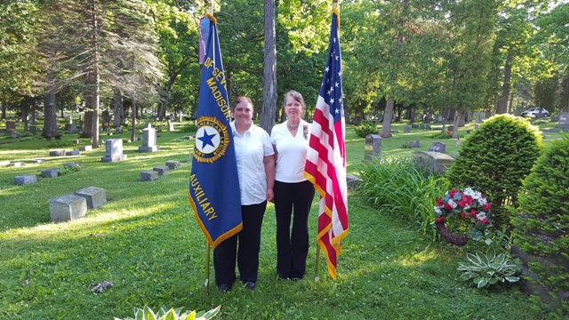 Unit 501 President, Rebecca Lovell, and Diana Jensen carrying flags at Forest Hill Cemetery, Madison, WI, on Memorial Day, May 30, 2016.