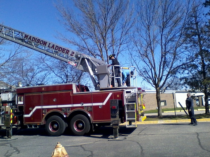 Making the final adjustments to the ladder closing on the flag pullley, within just a few inches.