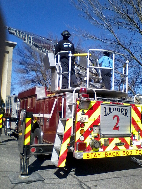 T he New Fireman in training loss the toss of the coin, he has to climb, while others supervise.