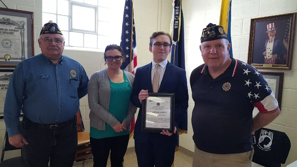 Cdr Tom Stolarczyk, Monona Grove Senior, Carter and his mother, Theresa, and 3rd District Cdr. Keith Lovell. present the Dane County Oratorical winning Scholarship, 1/5/2019.