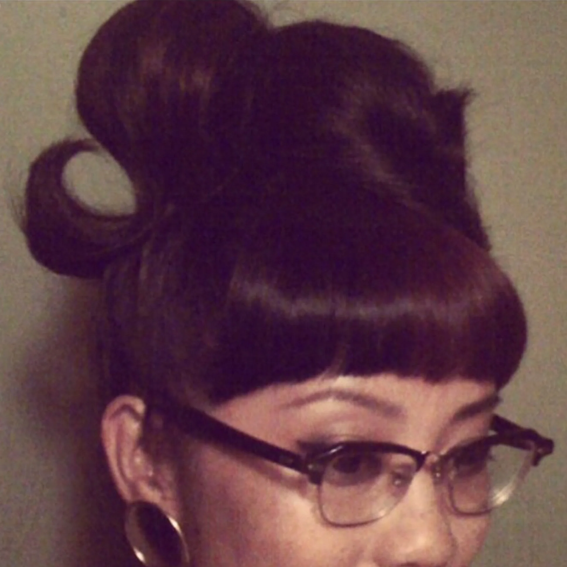 I often change my look from time to time depending on how long my hair is. My favorite hairstyles are big beehive, pinup looking updo's, 40's/50's wingtip liner eye make up, and vintage jewelry and frames. 
