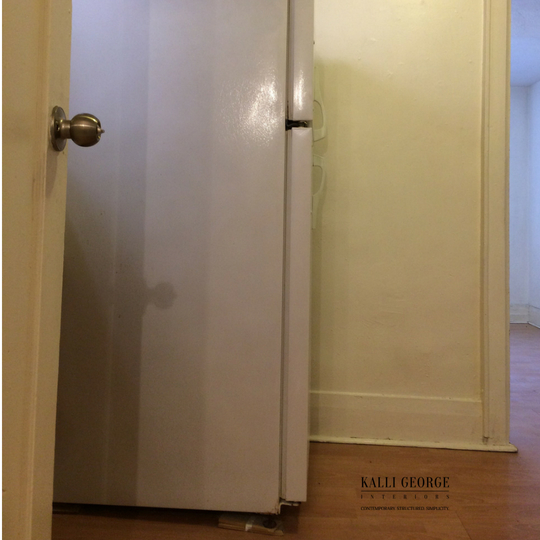 Image of kitchen with white refrigerator against wall.jpeg