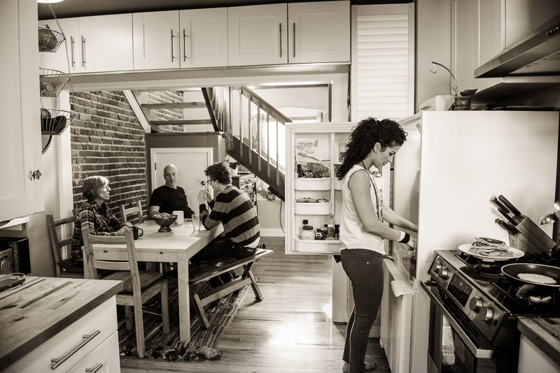 documentary photo of family preparing breakfast in Denver Alamo Placita Neighborhood