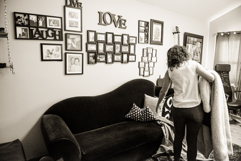 Woman cleaning her living room.