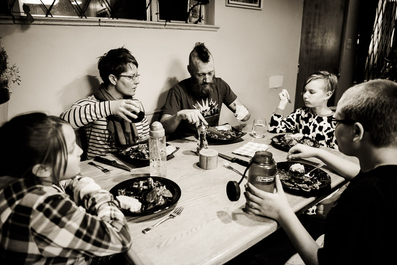 Informal family meal at dinner table.