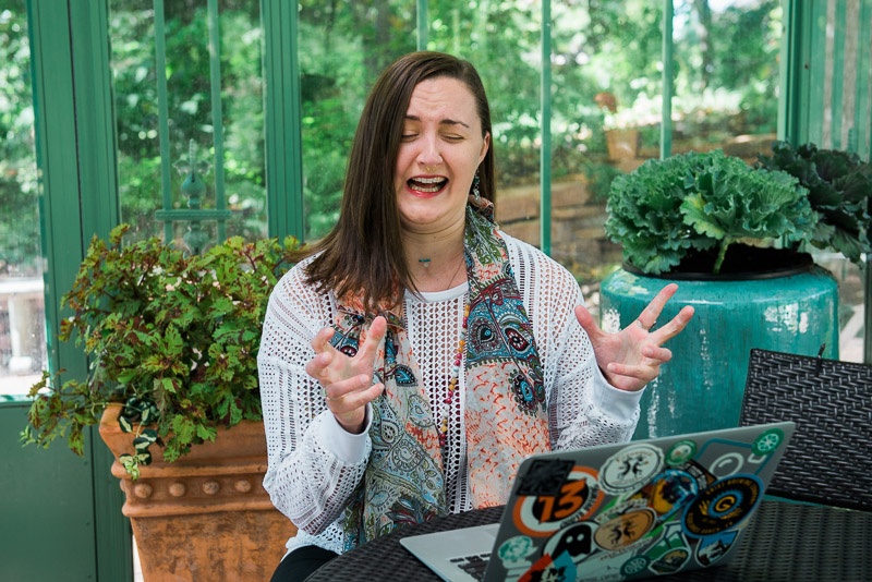 Funny photo of a woman making a face at her computer.