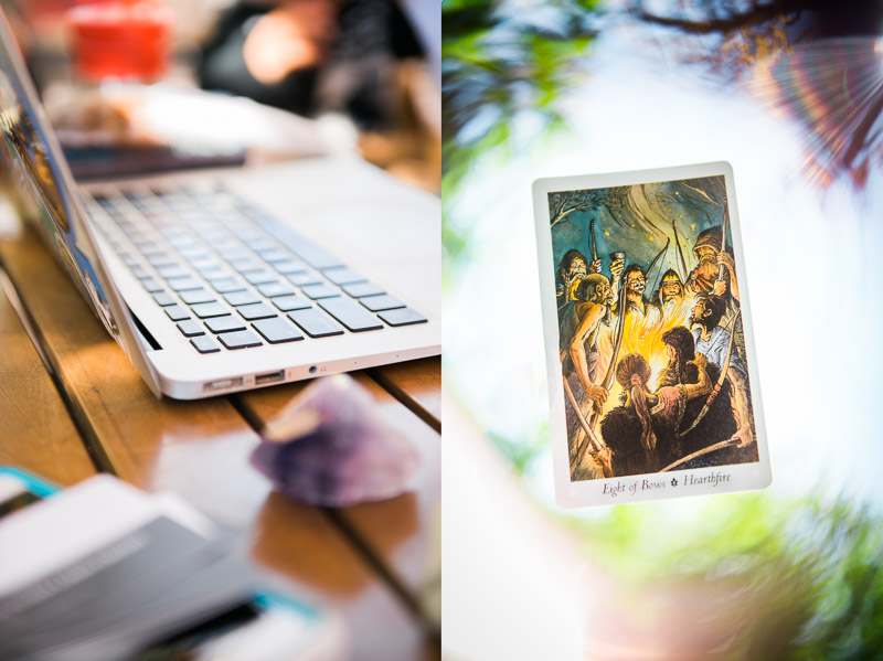 Photo of a laptop and a photo of the Hearthfire tartot card.