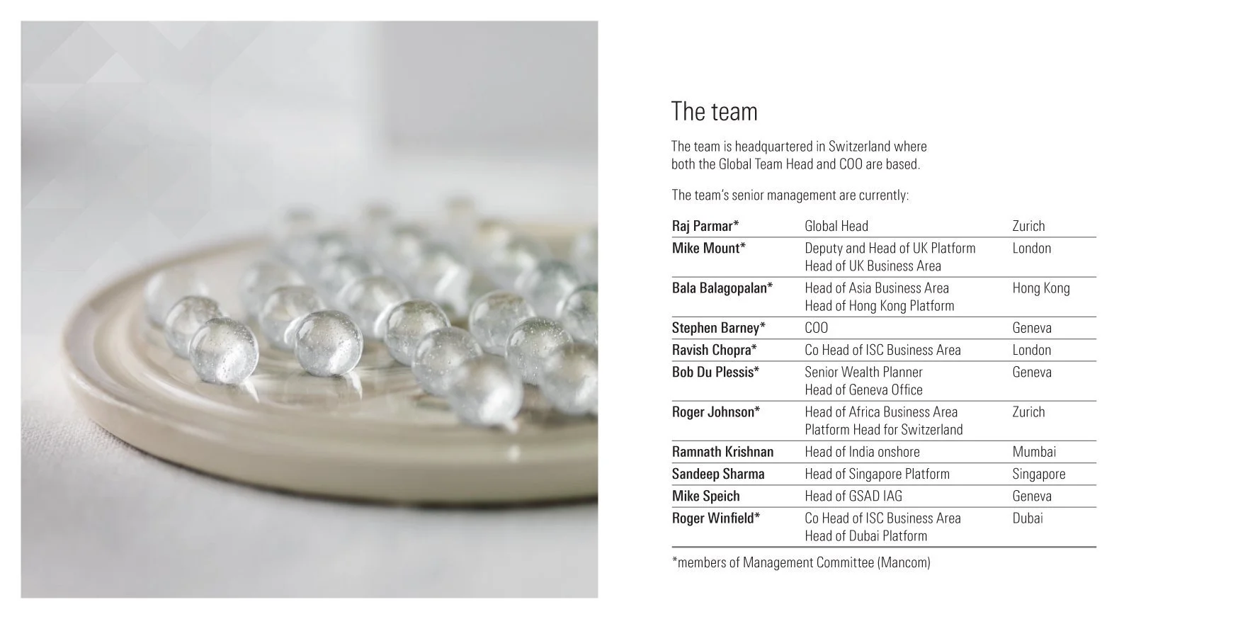 Clear marbles on the left-hand page of an inside spread of the square brochure for HSBC Private Bank