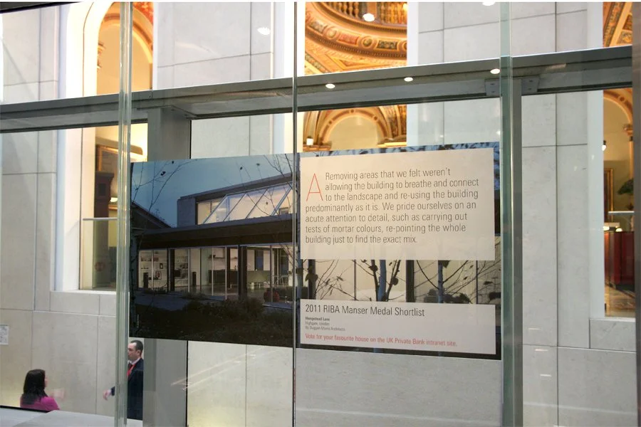 Reflective lift doors with an answer from the 2011 RIBA - HSBC Private Bank campaign.