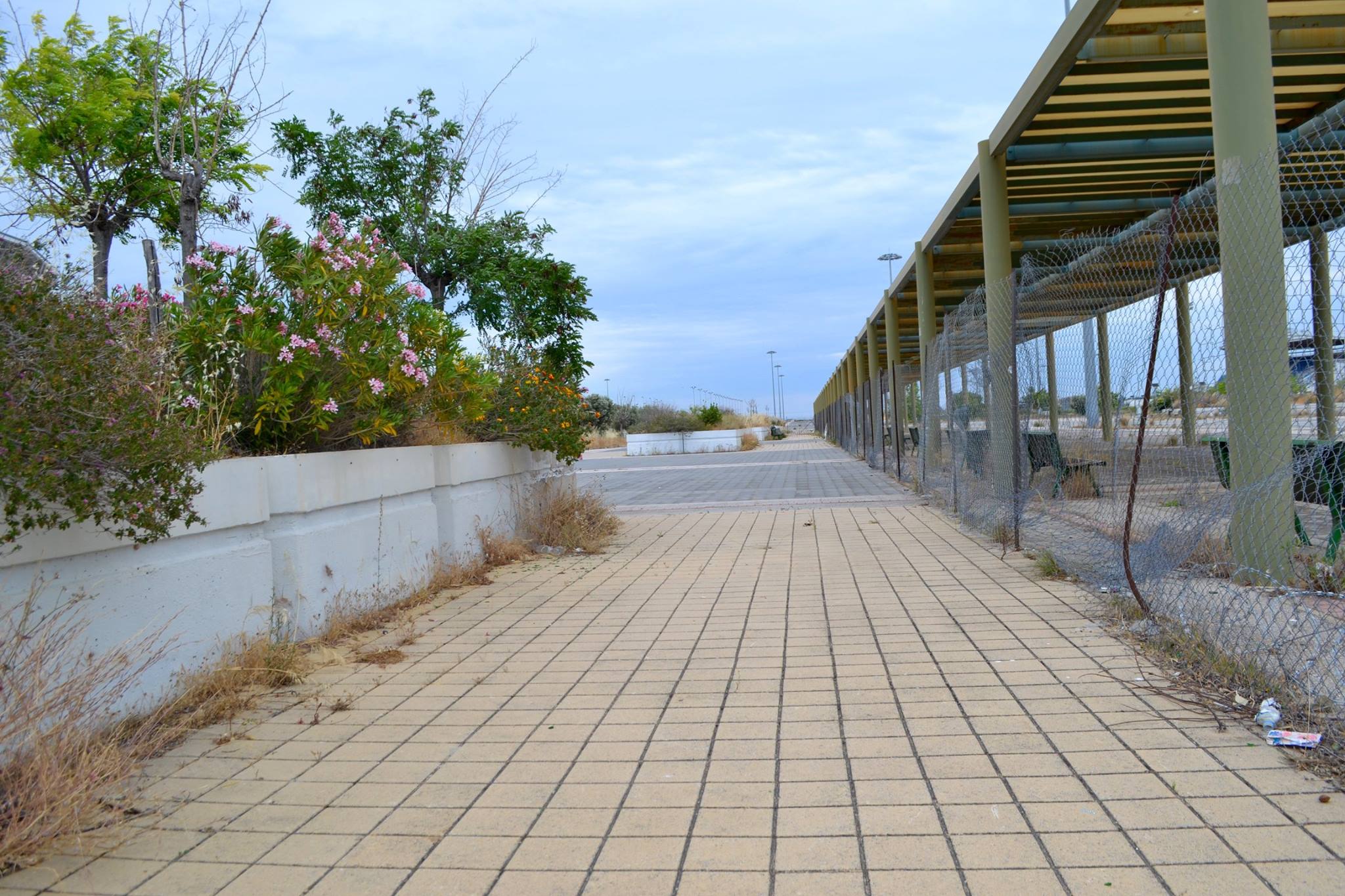 Photo: "Follow the Yellow Brick Road," Elliniko Refugee Camp, Greece. Melanie McCarthy