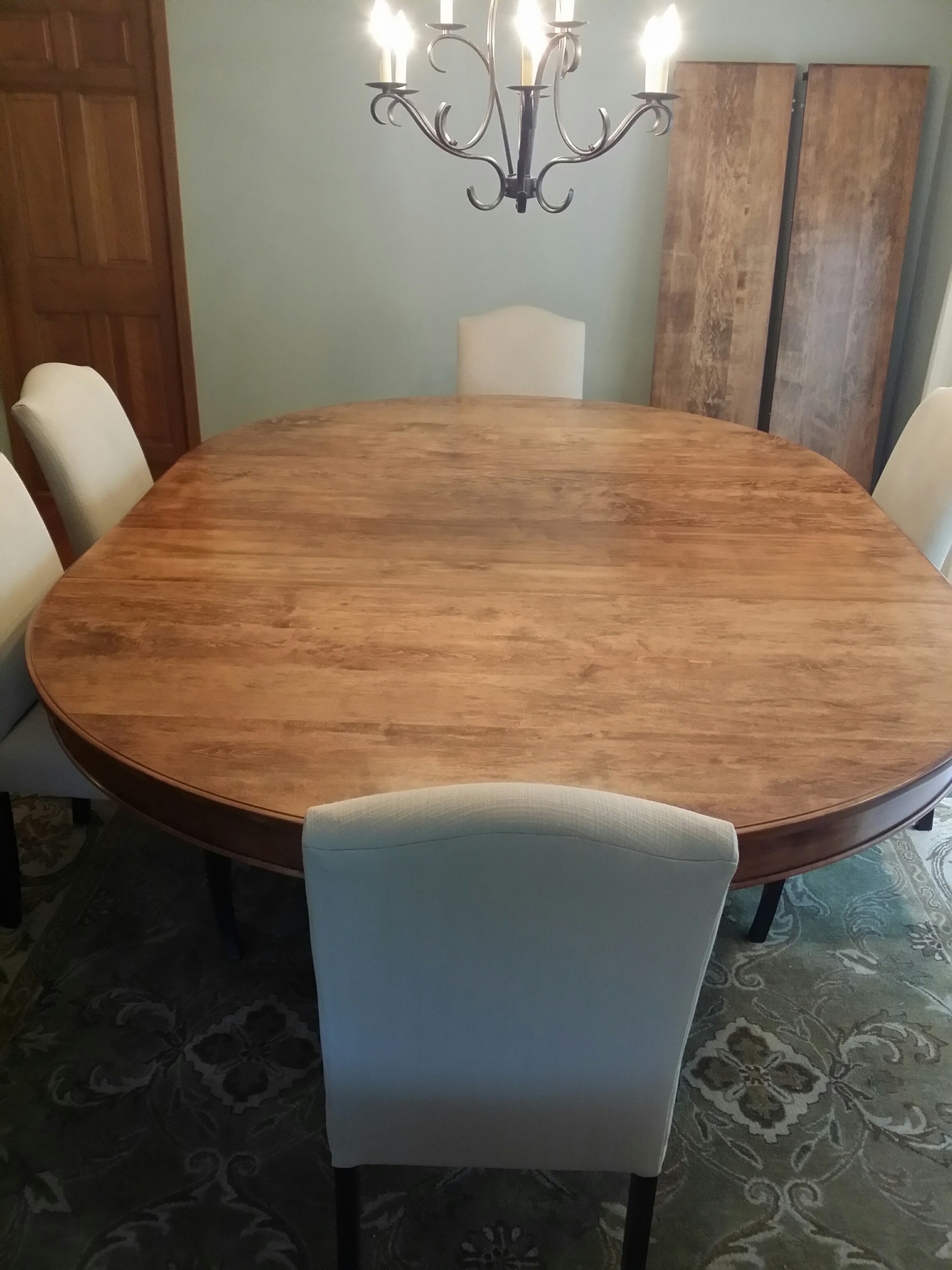 This table was commissioned by a client who wanted a table large enough to accommodate up to 16 people for family gatherings, but that could also be used in a smaller version for every day use. The challenge was that the client wanted a pedestal table, which meant it had to be designed to carry the weight when expanded to its 12-foot length without tipping. Dimensions: 72" diameter, expanding to 144" with four 18" leaves Table is shown here with 2 leaves (the other two are leaning against the wall) $6,200 (smaller sizes also available)