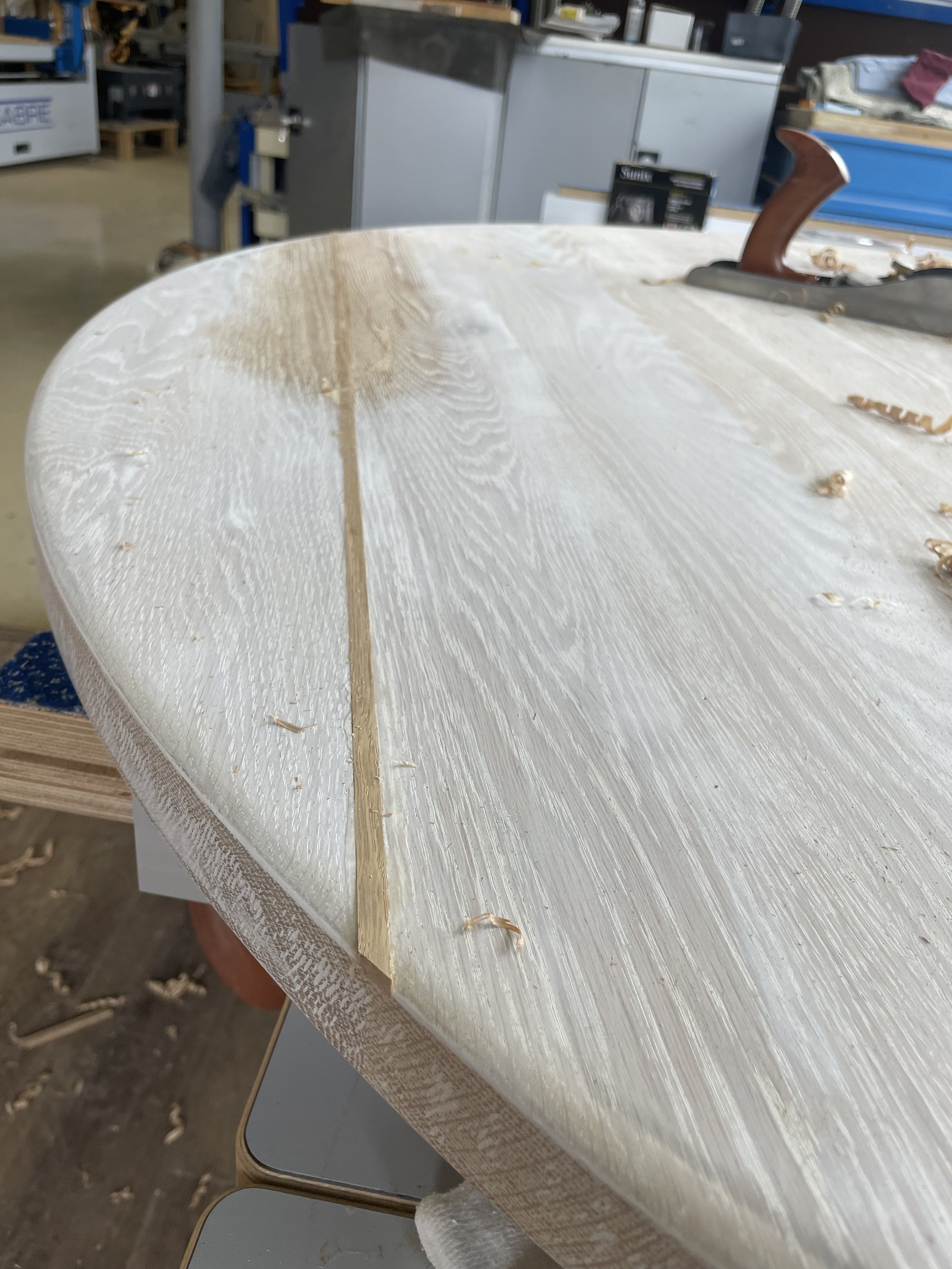 Sanding the patch flush with table top